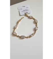 ÇELİK BİLEKLİK XUPİNG BAGET TAŞLI 14 AYAR GOLD RENGİNDE SAVOROSKİ TAŞLI 17+2 CM FMACCESORİES
