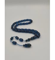 USTA İŞCİLİKLİ MAVİ  ATEŞ  KEHRİBAR TESBİH 8 * 12  MM KAPSÜL KESİM TAKIMLI SİSTEMLİ (Lacivert)