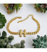 kadın bombeli çelik H harf bileklik (Altın)