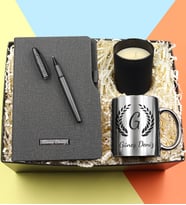 Kişiye Özel Termo Deri Gri Defter & Gri Mat Roller Kalem & Vanilya Kokulu Bardak Mum & Gümüş Renk Harf Kupa Hediye Seti