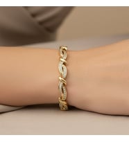 STİL İNCİSİ/XUPING JEWELRY SARMAL ZİRKON TAŞLI BİLEKLİK (Altın)