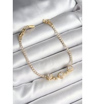 Pirinç Sıralı Kalp Figürlü Zirkon Taşlı Gold Renk Kadın Bileklik TJ-BB6981