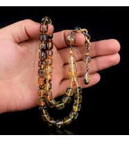 GÜMÜŞ PÜSKÜLLÜ FIÇI KESİM FOSİLLİ DAMLA KEHRİBAR TESBİH