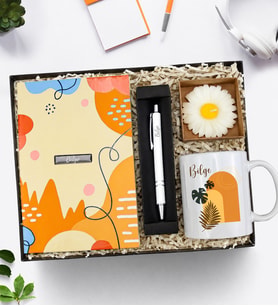Kişiye Özel Turuncu Tasarım Defter & Gümüş Renk Detaylı Tükenmez Kalem & Kraft Kutulu Mum & Kupa Hediye Seti