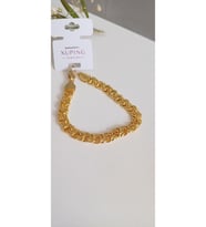 ÇELİK BİLEKLİK XUPİNG ALTIN  KAPLAMA ARPA 22 AYAR GOLD RENK GARANTİLİ KUYUMCU MODEL