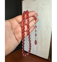 ATEŞ KEHRİBAR TESBİH PEMBE RENKLİ ŞEFFAF BEYZİ KESİM 7MM X 11 MM T-267