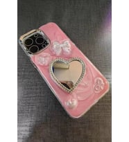 Caş Dekorasyon Pembe Renk Kalp Ve Kurdele Figürlü Aynalı 15 Pro Max Telefon Kılıfı