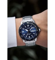 Casio MTD-125D-2A1VDF Gün ve Takvim Göstergeli 10 ATM Suya Dayanıklı Çelik Kordon Metalik Renk Erkek Kol Saati