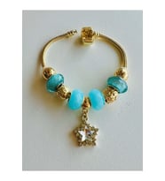 GOLD RENK TURKUAZ TAŞLI YILDIZ CHARM BİLEKLİK ACR7108