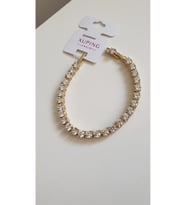 ÇELİK BİLEKLİK XUPİNG SU YOLU BAGET TAŞLI 14 AYAR GOLD RENGİNDE SAVOROSKİ TAŞLI 17+2 CM FMACCESORİES