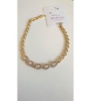 ÇELİK BİLEKLİK XUPİNG BAGET TAŞLI 14 AYAR GOLD RENGİNDE SAVOROSKİ TAŞLI 17+2 CM FMACCESORİES