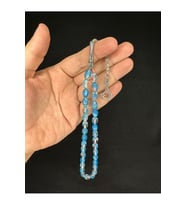 TOZ KEHRİBAR TESBİH MAVİ RENKLİ BEYZİ KESİM 10MMX6,5MM T-680