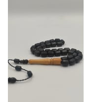 USTA İŞCİLİKLİ ABANOZ AĞACI TESBİH 8 * 12 MM KAPSÜL KESİM  TAKIMLI SİSTEMLİ PÜSKÜL (D.Siyah)