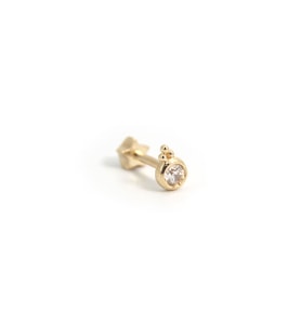 altın tragus helix piercin