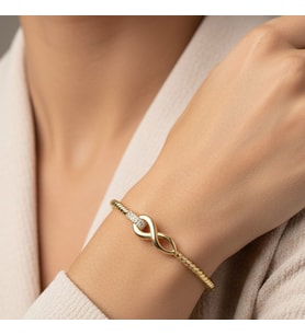 STİL İNCİSİ/XUPING JEWELRY SONSUZ MODEL ZİRKON TAŞLI KELEPÇE (Altın Rengi)