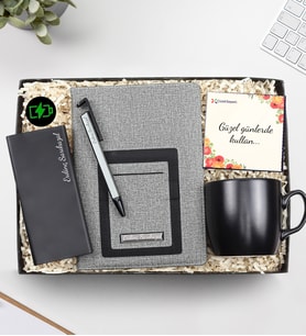 Kişiye Özel Telefon Cepli Gri Defter &  Siyah Mat Kupa  & Siyah Renk 10000 Mah Powerbank & Telefon Tutuculu Tükenmez Kalem Hediye Seti