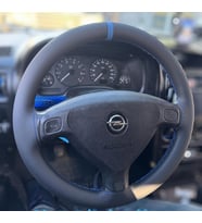 DİKİŞLİ DİREKSİYON KILIFI SİYAH DERİ MAVİ YÜZÜK MAVİ DİKİŞLİ OPEL ASTRA FOTODAKİ DİREKSİYON İÇİN