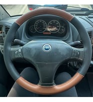 DİKİŞLİ DİREKSİYON KILIFI TABA / SİYAH DERİ SİYAH DİKİŞLİ Fİ.AT DUCATO 2 İÇİN